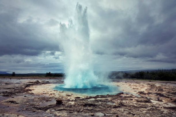Strokkur Geyser in Iceland Strokkur is a fountain geyser located in a geothermal area beside the Hvítá River in Iceland in the southwest part of the country, east of Reykjavík. golden circle route photos stock pictures, royalty-free photos & images