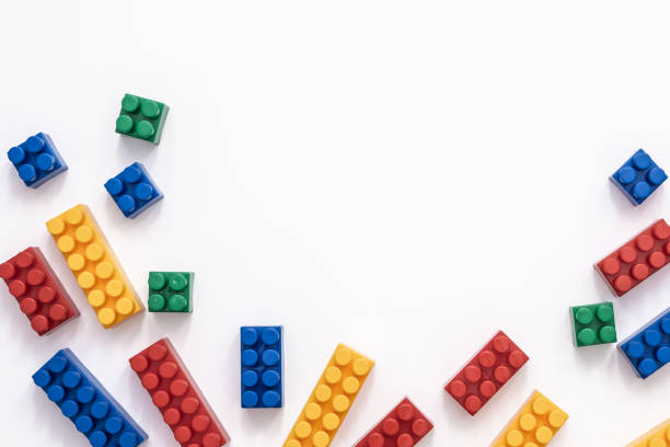 istock On a white background in a chaotic manner are large multi-colored childrens blocks-designer for the construction of houses and buildings of varying complexity. copy space 1170682873