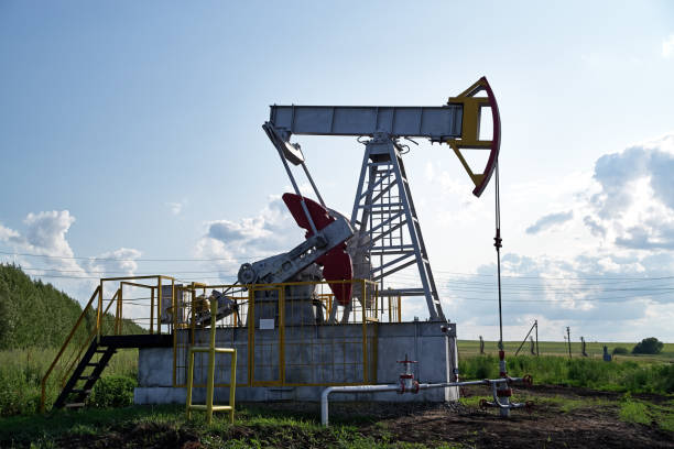 istock Oil pump, field, blue sky 1170683435