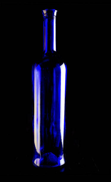 istock Blue wine bottles still life with colourful background 1170683583