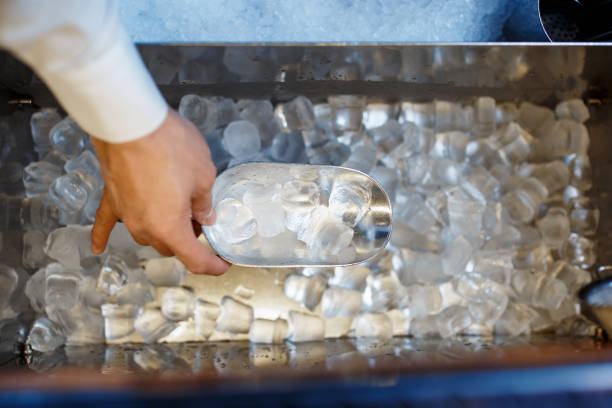 istock barman scoops up ice for making alcohol cocktail 1170688293