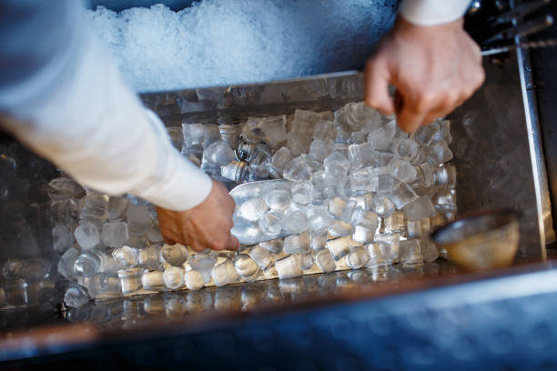 istock barman scoops up ice for making alcohol cocktail 1170688342