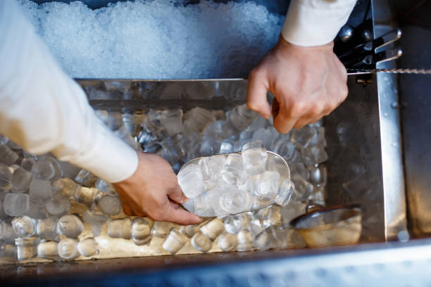 istock barman scoops up ice for making alcohol cocktail 1170688356