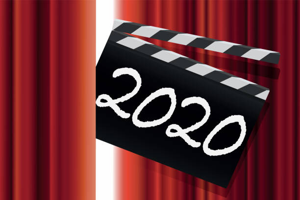 2020 greeting card for film and entertainment. A cinema clap with the inscription 2020, passes through the red curtain of a show stage, to present the new year. toronto international film festival stock illustrations