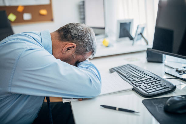 istock Businessman napping in the office 1170694496