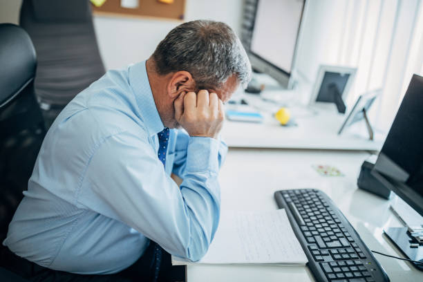istock Businessman doing paperwork in the office 1170694518
