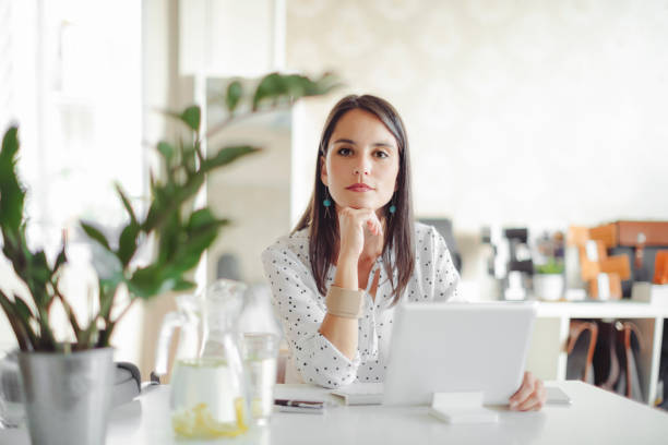 istock Young woman working in her office 1170696199