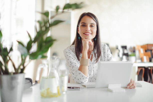 istock Young woman working in her office 1170696212