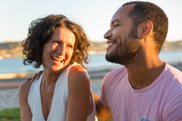 istock Sweet couple dating outdoors, chatting and having fun 1170698507