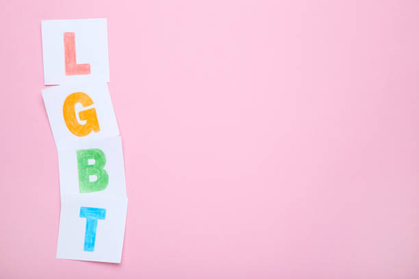 istock Paper with abbreviation LGBT on pink background 1170698580