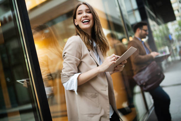 istock Urban happy business woman using tablet computer and working 1170698862