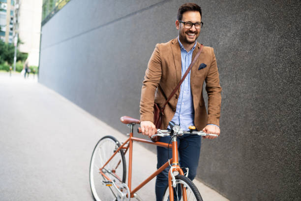 istock Young businessman riding on his bicycle. Going everywhere by his bike 1170699086