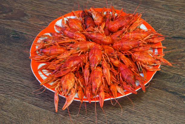 istock Still life with crayfish crawfish on old wooden background 1170699628