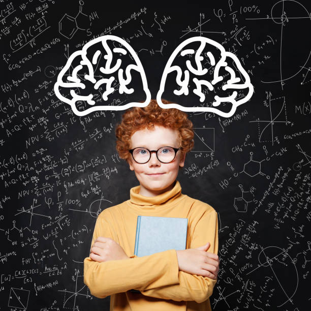 istock Little smart boy portrait. Kid with book and brain scetch 1170699716