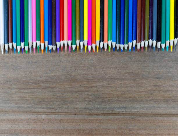 istock Many color pencils on wood background with copy space for text or design. 1170700020