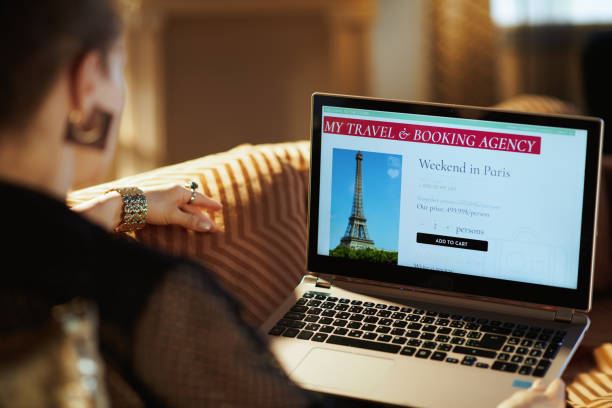 istock young woman using online travel booking site on laptop 1170700123