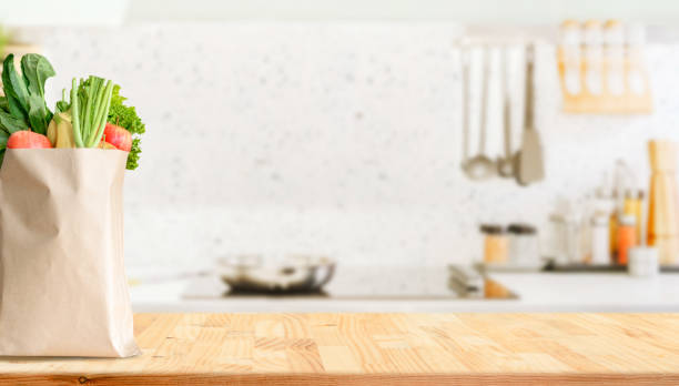 Wood table top on blurred kitchen background stock photo