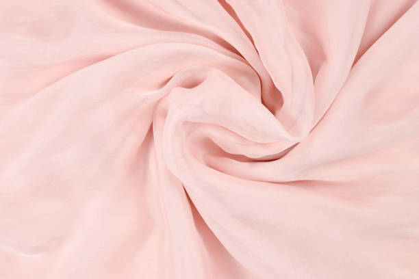 istock Soft smooth pink silk fabric background. Fabric texture. 1170702350