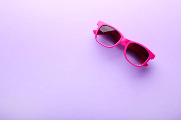 istock Modern sunglasses on purple background 1170708972
