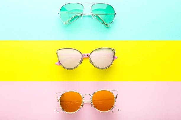 istock Modern sunglasses on colorful background 1170709237