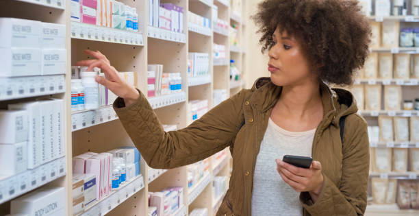 istock Woman taking medicine bottle from shelf 1170709379