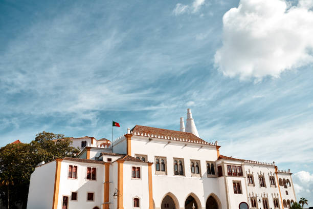 Shot of a government building with the national flag standing on the rooftop in Sintra, Portugal
