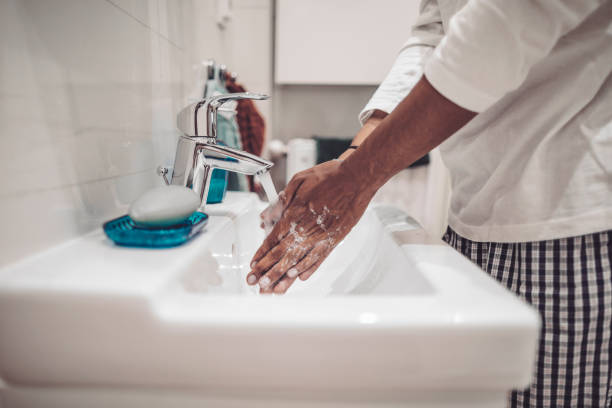 istock At home - young man brushing his teeth 1170713202