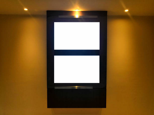 istock Blank advertising TV poster billboard on  wall.two blank frame on wall. 1170715840
