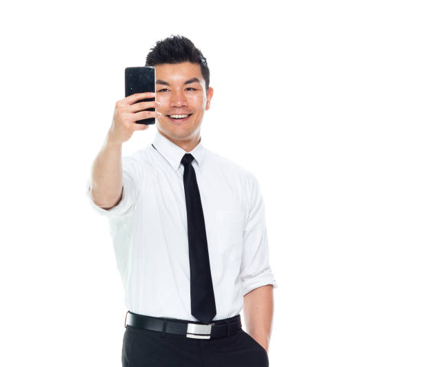 istock Handsome Asian Businessman - taking a selfie 1170718645