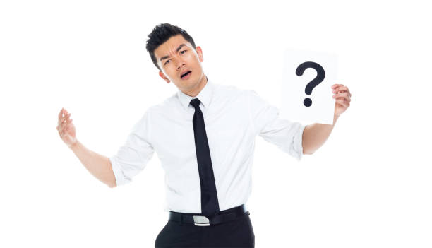 istock Handsome Asian Businessman - is holding a question mark sign 1170718777