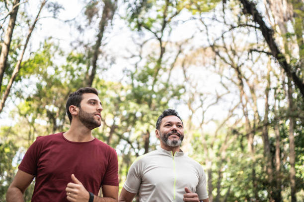 istock Friends running together in a park 1170719143