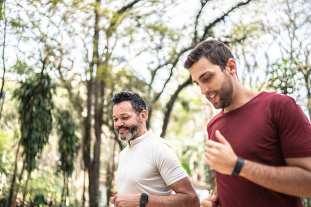 istock Friends running together in a park 1170719146