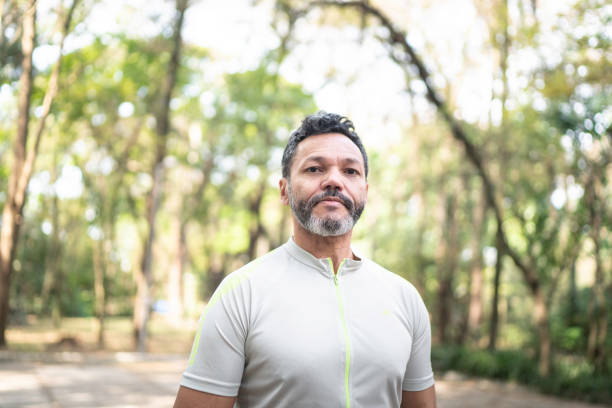 istock Portrait of a man in a park 1170719148