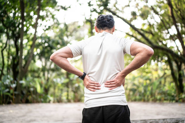 istock Sportsman feeling backache at a park 1170720476