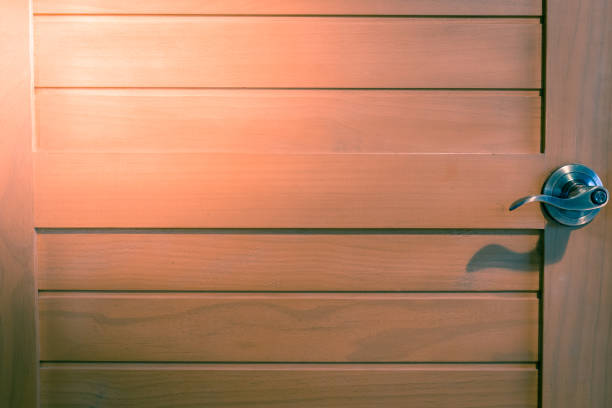 istock Wooden door with knobs detail texture 1170720509