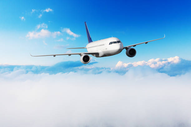 istock Passengers commercial airplane flying above clouds 1170721862