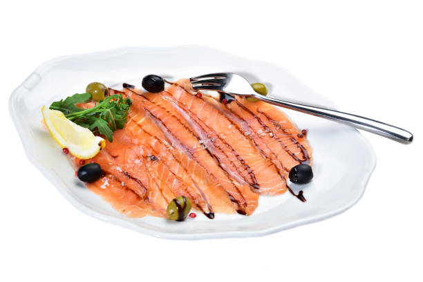 istock Sliced salmon on a plate on an isolated white background 1170721973