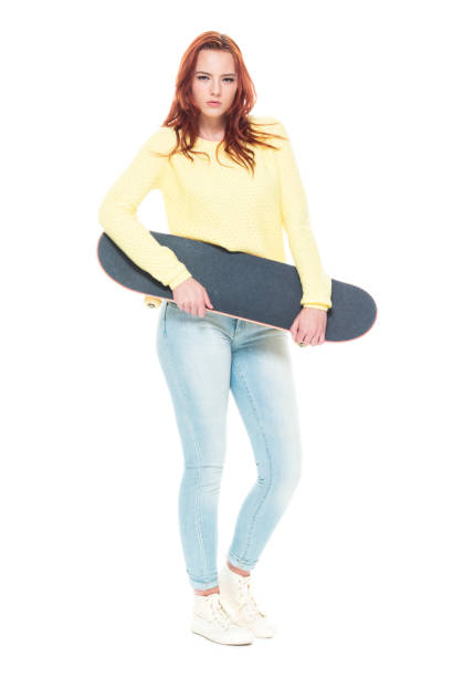 istock Cute female holding a skateboard 1170722279