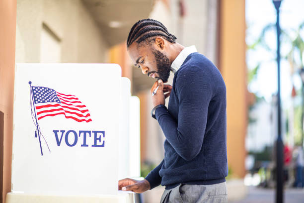 istock Millenial Black Man Voting in Election 1170722508