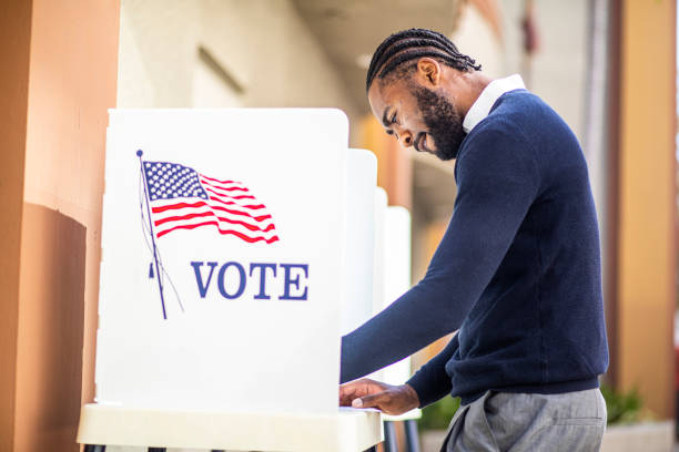 istock Millenial Black Man Voting in Election 1170722599