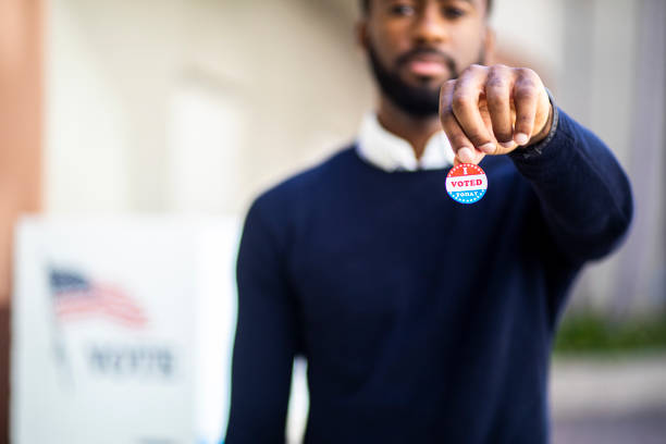 istock Young Black Man with I voted Sticker 1170722736