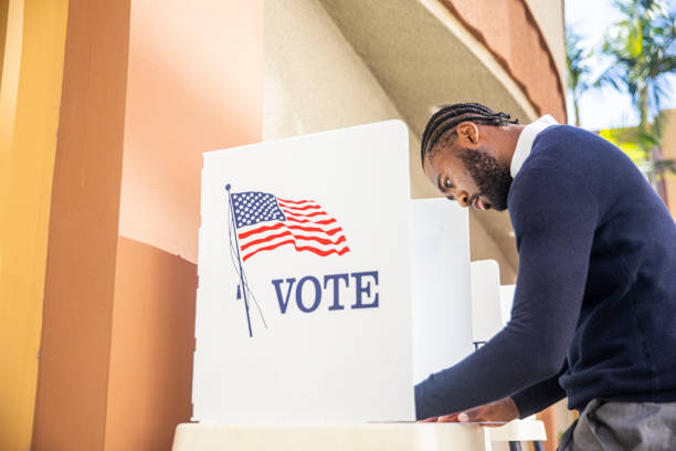 istock Millenial Black Man Voting in Election 1170722808
