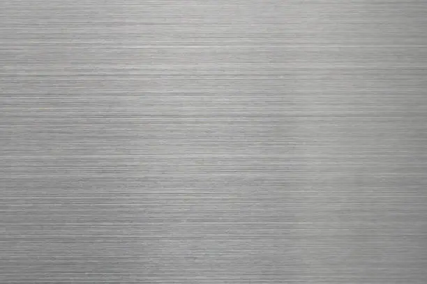 Empty brushed metal surface. Abstract background for design and backdrop.