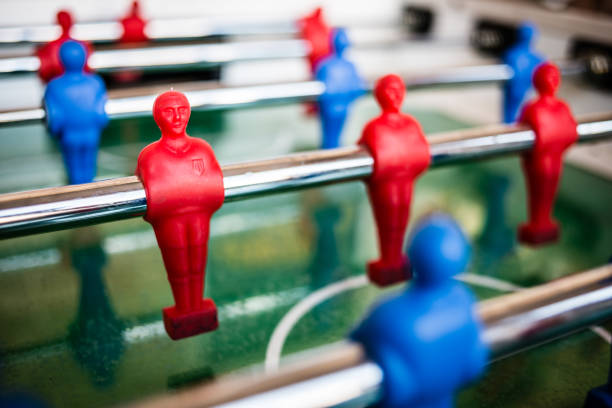 Old table football worn with players from the Real Madrid and Fútbol Club Barcelona teams