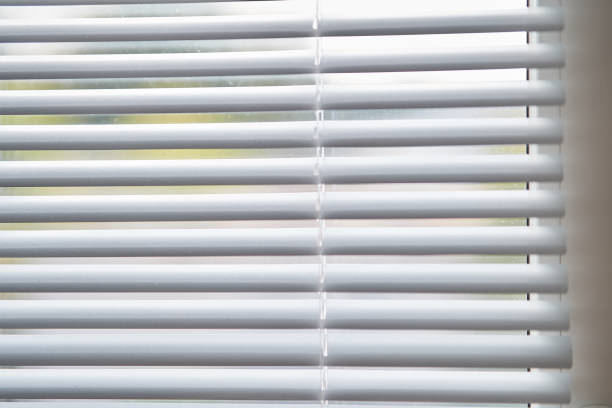 istock Closeup view of window with horizontal blinds 1170728373