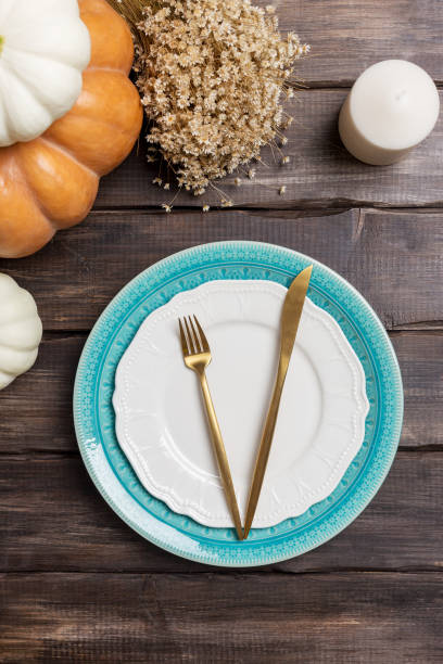 istock Empty plate with harvest decor and golden tableware 1170728429
