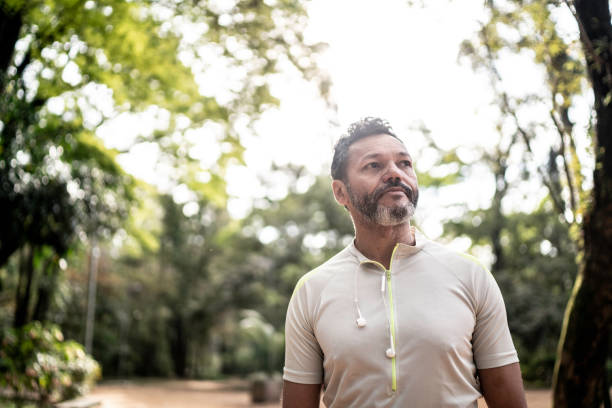 Man in a park, looking away