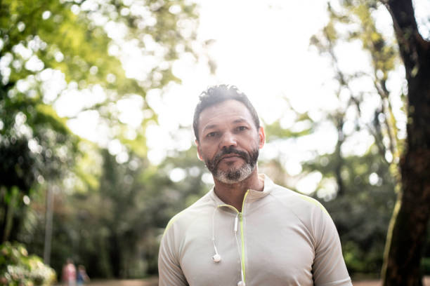 istock Portrait of a man in a park 1170728527