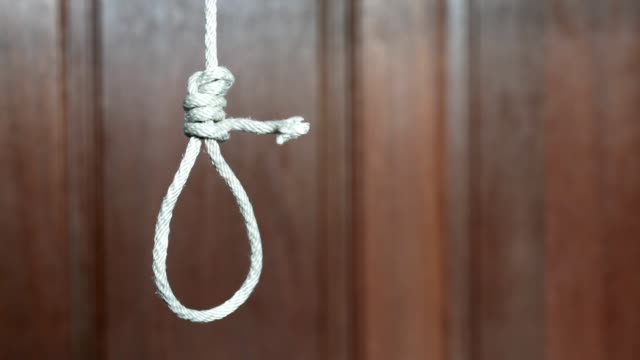 commit suicide concept, Hangman's noose knot hang from the ceiling