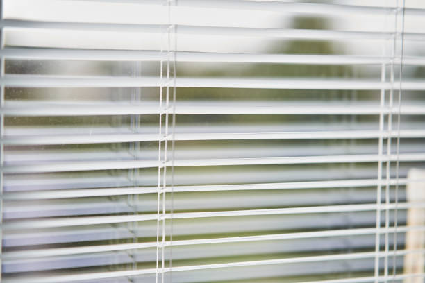istock Closeup view of window with horizontal blinds 1170728808